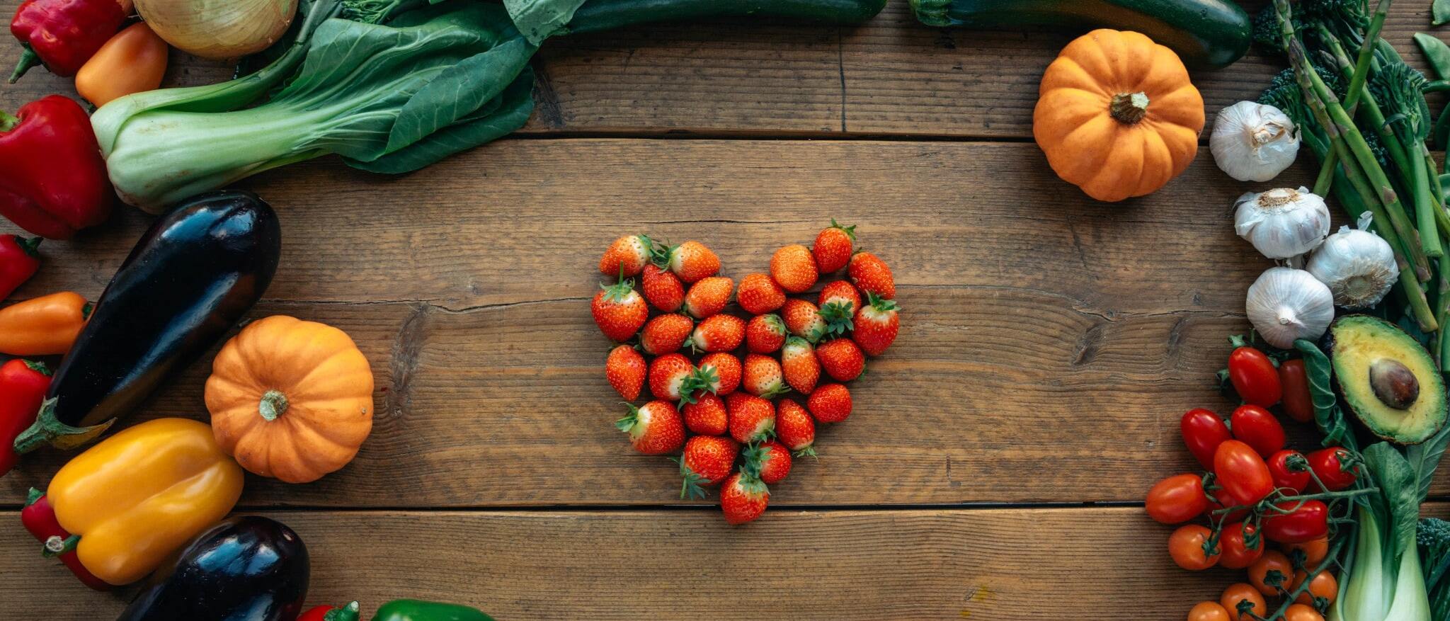 different vegetables and fruit on wood